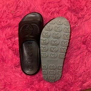 Women’s black Gucci slides